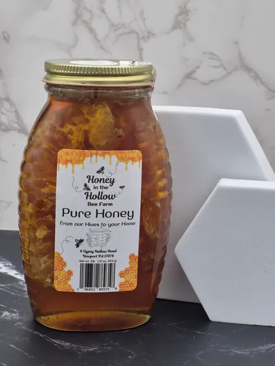 Chunk Honey 1 comb honey in glass jar with honey, called chunk honey